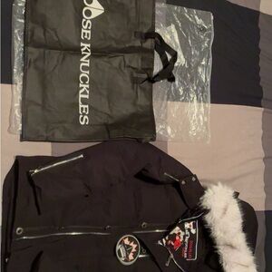 Moose Knuckles Black Puffer with White Fur Trim
